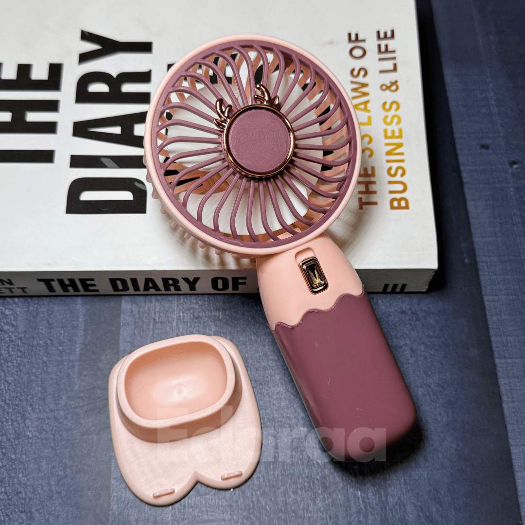 Pink handheld rechargeable fan with USB wire