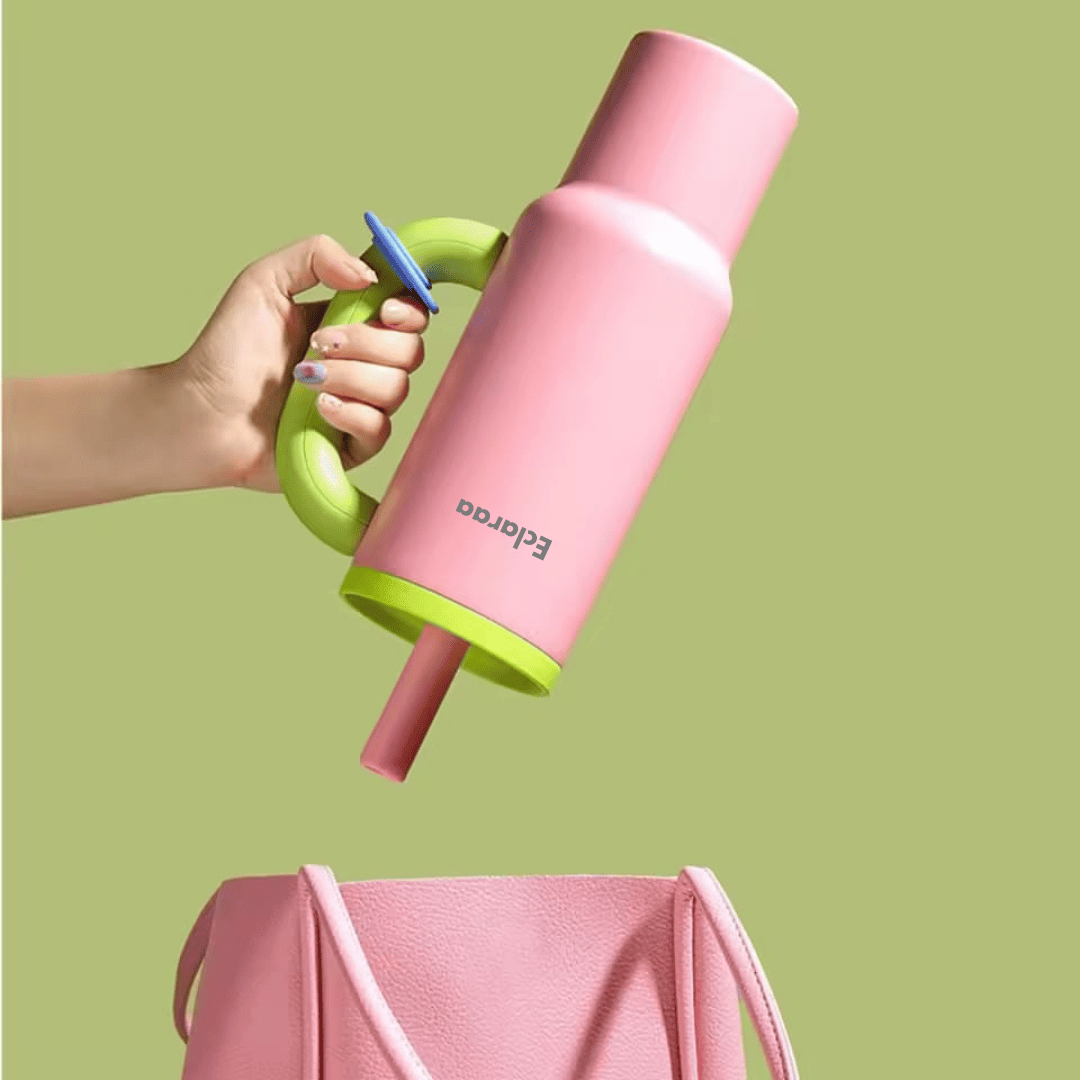 Pink cute tumbler cup 1200ml with a straw held by a hand