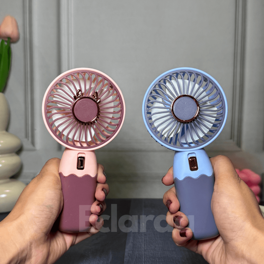 Two handheld fans, one pink and one blue rechargeable fans
