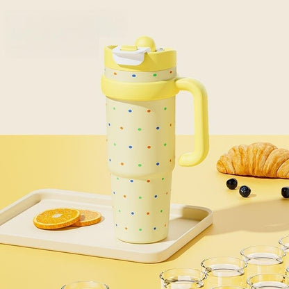 Yellow 1000ml thermos with colorful polka dots and wuth a straw