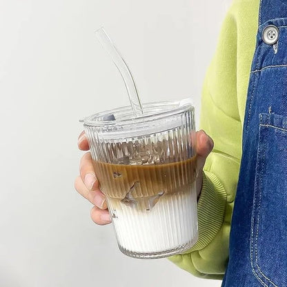 Coffee tumbler made from clear glass with ergonomic lid and straw