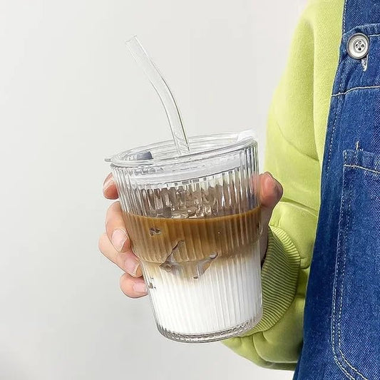 Coffee tumbler made from clear glass with ergonomic lid and straw
