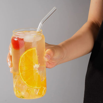 Top view of can shaped glass tumblers with straw